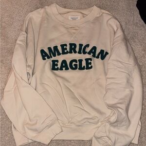 American Eagle Cream Pullover with Green Lettering
